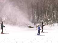 Skiers passing Snow Guns on the way to Snowdon, March 16, 2006, 10:30 AM