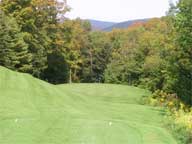 The 3rd hole at the Killington Resort Golf Course starting to display fall foliage colors.