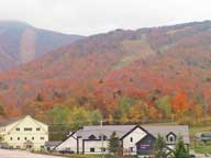 Fall Foliage behind Rams Head Base Lodge at Killington