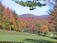 Colorful backdrop graces the 5th green <br />on the Killington Resort Golf Course