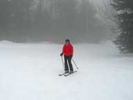 Mary skiing towards the entrance of Bear Claw from Great Eastern.