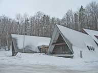 Birch Ridge Inn covered in something white