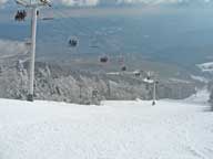 Skier exiting Bear Mountain on Skye Peak Quad.  Bear Chair at Outer Limits down due to wind.