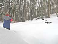 Taking picture of the snow stake after last nights snowfall.