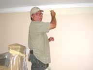 Cutting in ceiling trim in Room 5.