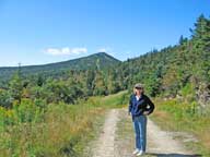 Mary on Sky Peak with Killington Peak in background.