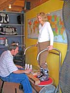 Mary being fitted for new ski boots by Ray at Surefoot