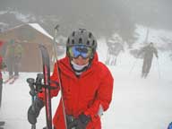 Mary being buffeted by high winds on Killington Peak just off K1 Gondola.  Notice the strap on her ski pole being held in the air by the wind.