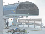 Worker reading the new high speed quad on Sky Peak for tomorrows opening day