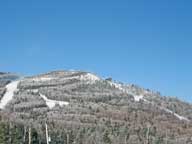 Sky Peak and the Stash under brilliant blue skies a seen from top of Bear Mountain.