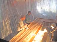 Frizzie and Roger repairing the bar top.