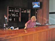 Mary applying poly to the bar top.