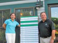Green Mountain National Golf Director Dave Soucy congratulates 2009 Ladies Club Champion Nina Tasi