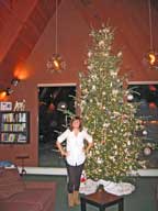 Killington Snow Dance Winner Kara McQueeney under the Christmas Tree at the Birch Ridge Inn.