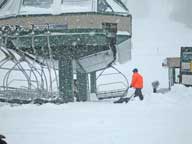 Resort workers struggling to remove snow from the base of the Summit Express at Pico