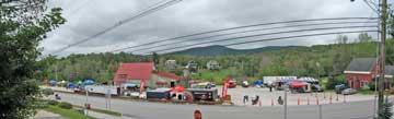 Under cloudy skies, the Killington Classic HQ gets set up at the Wobbly Barn, across the Killington Road from the Birch Ridge Inn.