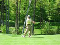 Driving the ball off the 6th tee at Green Mountain National Golf Course.