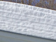 Layers of snow on the roof of the front portico at the Birch Ridge Inn, Killington