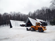 Bucket loader clearing snow at the Birch Ridge Inn