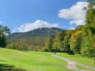 Color developing at Killington.  From 15th tee on Killington Golf Course looking towards Superstar and Skye Peak.
